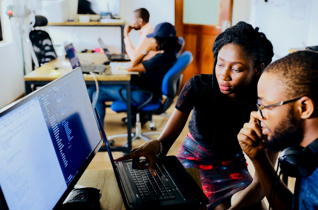 coding mentor helping student