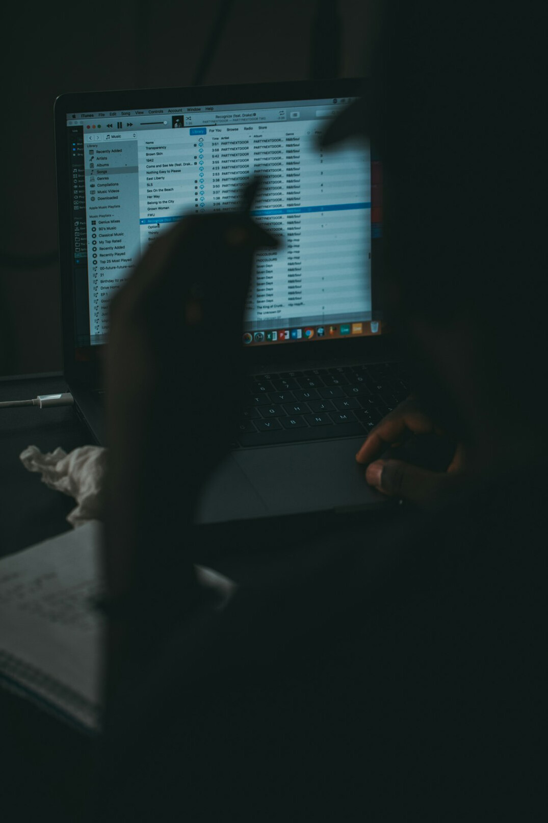 person coding on laptop